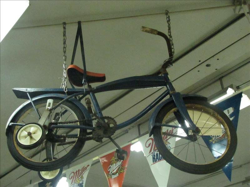 Vintage Western Flyer Kids Bike: Vintage Western Flyer Kids Bike Made by Western Auto Supply Co. This bike is blue with a red seat, training wheel and a back tray. The wheel are very stiff rubber. The pedals turn but with some effort