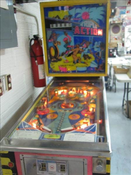 1973 Williams Pinball Machine: 1973 Williams Pinball Machine Williams triple action pinball machine. This machine plays off one quarter for 5 balls. This has an Arabian theme. Fully functioning and lit game. Keys are included. This
