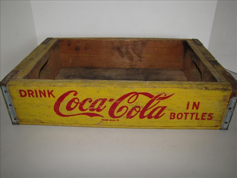 1968 Yellow Coca Cola Crate: 1968 Yellow Coca Cola Crate Marked Chattanooga 1968. Yellow case with Coca Cola logo on two outer and one inside. 11.5" x 18" x 4" tall. Unique design with double layer wood at handle ends.