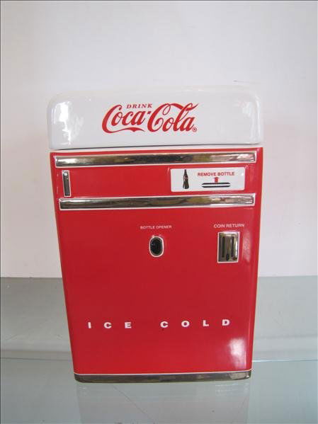 Drink Coca Cola Cookie Jar Canister: Drink Coca Cola Cookie Jar Canister Great Coca Cola cookie jar or canister. This has a removable lid and is styled like a vintage Coke machine. This is a trademarked piece. This measures 8.5" x 5.5" x