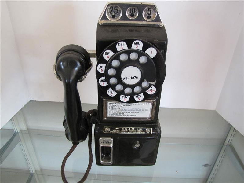 Jim Beam Novelty Telephone Bottle.: Jim Beam Novelty Telephone Bottle. Ceramic Jim Beam bottle. 13.5" tall. Black rotary telephone bottle.