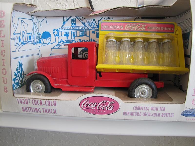 1930's Stamped Steel Coke Truck: 1930's Stamped Steel Coke Truck This is a bottling truck made by Gearbox. This is made of steel with real glass windows. New in the box.