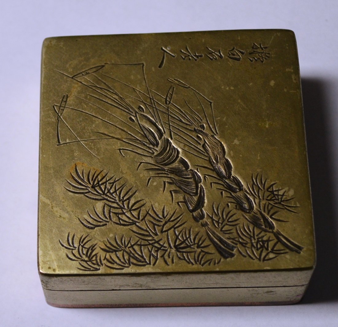 Early brass on copper Chinese box impressed shrimp: Copper & brass box with fur or silk like lining inside. Box in impressed with shrimp with Chinese or oriental lettering. Box measures 3 inches wide by 3 inches wide and 1 1/4 inch height. Box comes fr