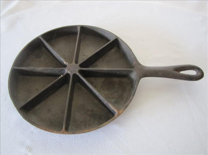 9" Cast Iron Corn Bread Skillet: 9" Cast Iron Corn Bread Skillet This has 8 sections for corn bread and is marked "Corn Bread Skillet" on the base.