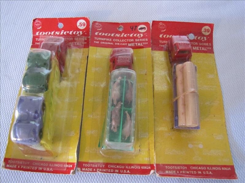 Lot of 3 NIP Toostie Toy Trucks: Lot of 3 NIP Toostie Toy Trucks This lot includes 3 new in the package Tootsie Toy trucks. This includes a die cast car hauler, log truck and livestock truck. All 3 are unopened and measure 4.5" - 5" 