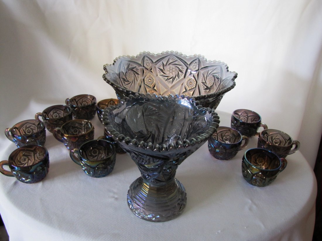 Imperial Glass Carnival Glass Punch Set: Vintage Carnival Glass Punch Set This set includes the punch bowl, riser and 12 cups. This set is from with rounded edging. The bowl measures 14" wide across the top and 7" high. The base measures 7.5