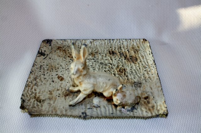Vintage Hammered Aluminum Tray: Vintage Hammered Aluminum Tray This tray is hammered aluminum with 2 cast rabbits attached. This measures 6.5" x 5.25" x 3". The bottom was green and the top was white. There is wear to the paint on e