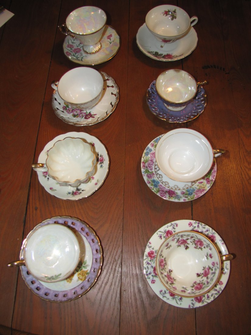 8 Porcelain Tea Cups & Saucers: 8 Porcelain Tea Cups & Saucers This lot includes 8: footed tea cup in rose pattern with matching saucer, Norcrest lustreware purple with yellow roses, footed rounded edge cup with rose pattern, marked
