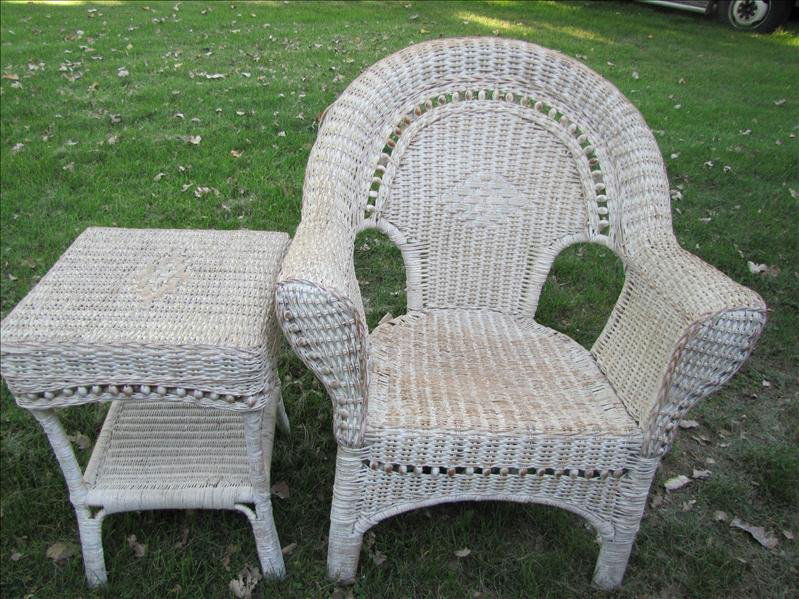 White Wicker Chair and Table: White Wicker Chair and Table This set includes a white wicker high back chair and matching table. Each piece has brown wicker tinting. The chair measures 3 ft tall x 30" x 23". The table measures 23"