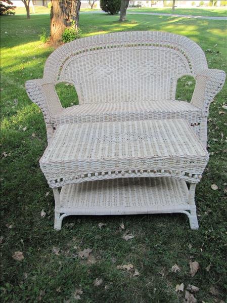 White Wicker Couch and Table: White Wicker Couch and Table This is a white wicker couch and table. It has brown wicker tinting. The couch measures 34" tall x 55" x 24". The table measures 31" long x 18.5" wide x 19" long and has a