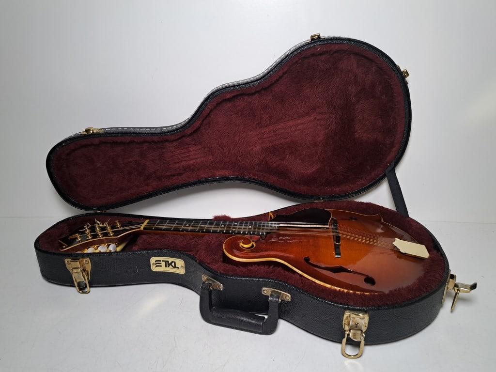 James Shenk Mandolin: James Shenk number 144 Mandolin, dated 2007, beautiful condition, signed on neck, mother of pearl inlay, CDL in head, excellent condition with TKL World Class Cases hard case, see photos.