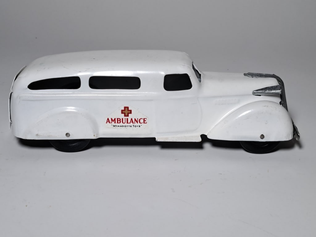 Vintage Wyandotte Toys Pressed Steel Ambulance: Vintage Wyandotte Toys pressed steel ambulance, 11 1/8 in. bumper to bumper, back door opens, original graphics, see photos for condition.