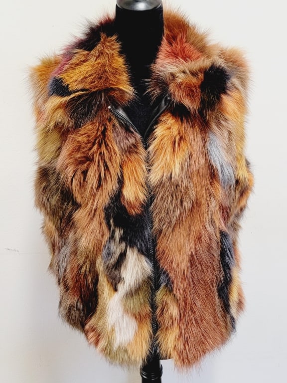 Reversible Leather/Fur Vest: Reversible leather/fur vest, 16 at the shoulder, 24 collar to hem, good condition, see photos.