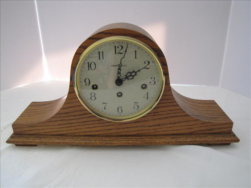 Howard Miller Mantel Clock: Howard Miller Mantel Clock Model 612-618. 17.5" wide and 7.75" tall. Has key.