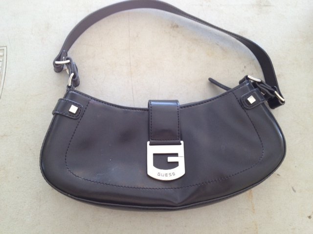 Guess leather purse: Guess handbag or purse. 11.75 inches wide, leather.