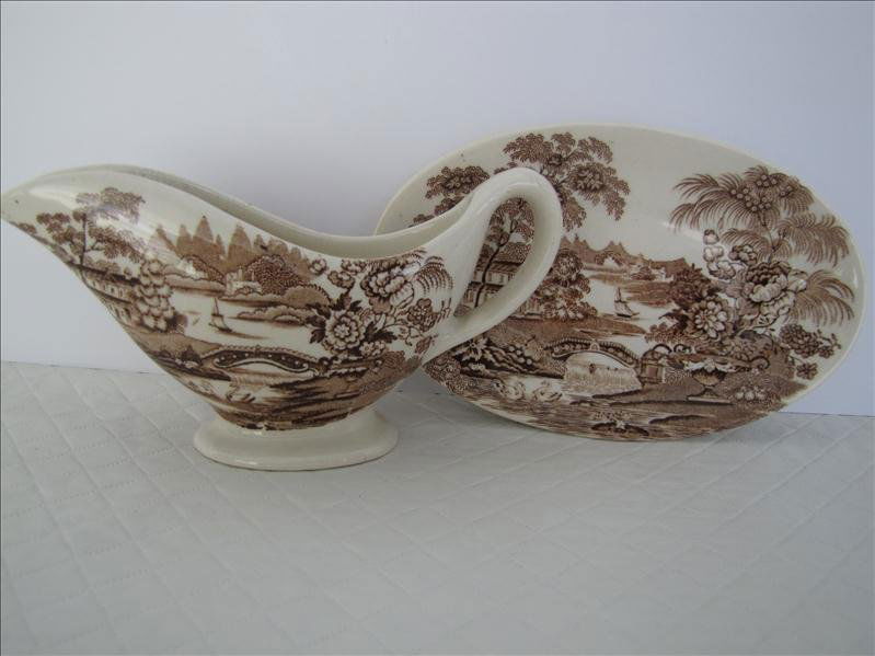 Royal Staffordshire Dinnerware by Clarice Cliff: Royal Staffordshire Dinnerware by Clarice Cliff. Creamer and under plate England china dinnerware designed by Clarice Cliff. "Tonquin." The creamer measures 5.5" wide and the under plate is 5.5" long