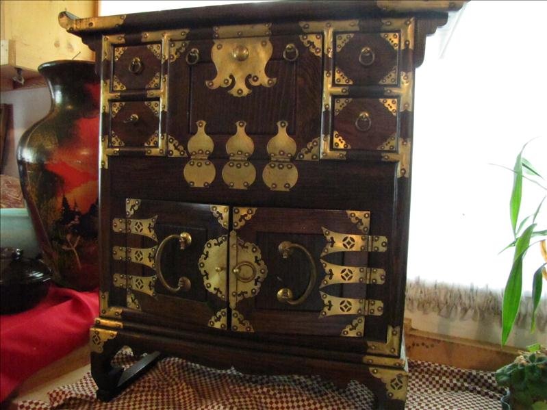 Ornate Oriental Chest: Ornate Oriental Chest Very decorative unique dark wood chest with brass metal work escutcheons. Chest measures 26.5" wide and 26.5" tall, and 12.5" deep. Very unique nice piece.