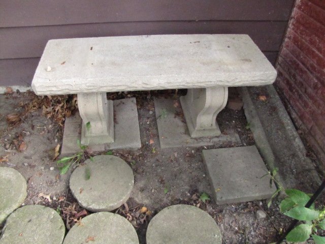 Concrete Accent Garden Bench: Perfect piece of garden or yard decor. This is a three piece bench that measures 42.5" long, 15.5" deep, and 18" tall. The legs of the bench have a heart carved into them.