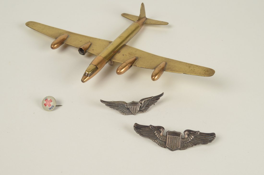Trench Art Fighter Plane & WWII Silver Pins: Brass Fighter Plane, WWII Sterling Pins, and medic 1920 pin. Brass fighter model airplane has some spotting, one nacelle "the outer casing of an aircraft engine" is broken and another is loose. Please