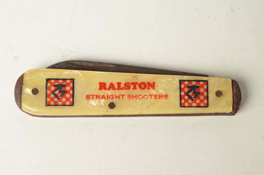 Advertising Tin & Pocket Knife: 2 Advertising Items. This lot is for a Ralston Straight Shooters pocket knife. . Purina commissioned a special Tom Mix knife to be made for members of the Club. This two bladed swell end jack is handl