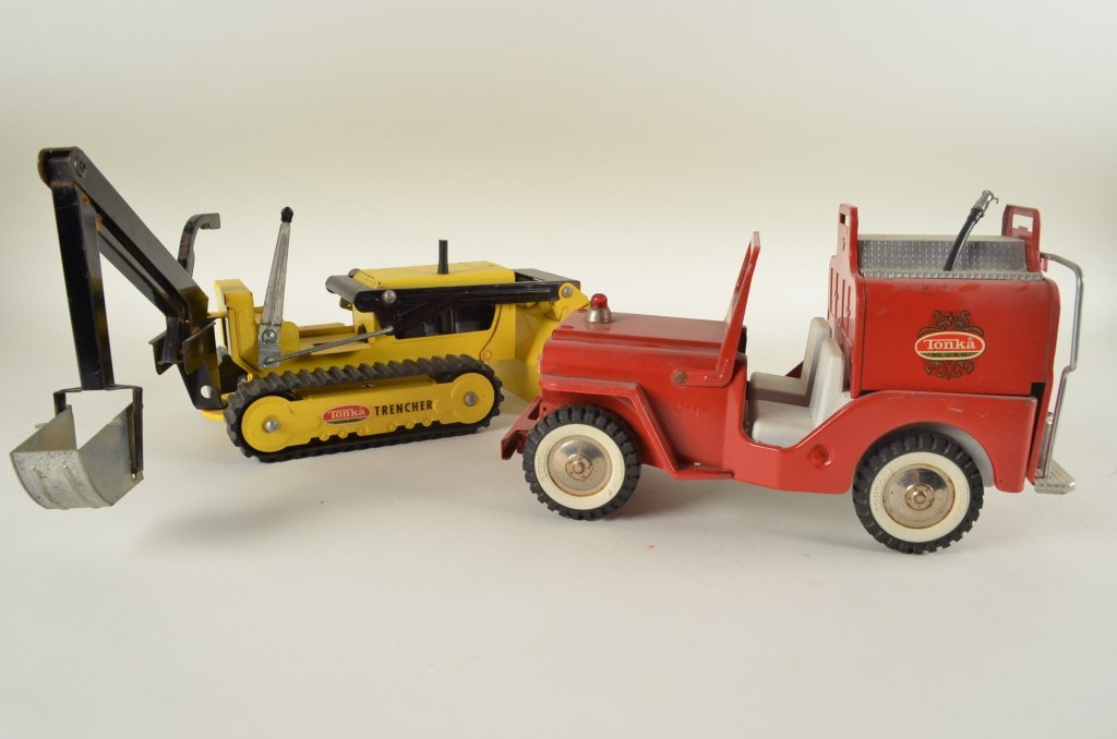 Tonka Jeep Fire Truck and Trencher: Vintage Tonka Fire Truck and Tonka Trencher. Both pieces are in good working condition with some paint chipping. The fire toy fire truck is missing the ladder.