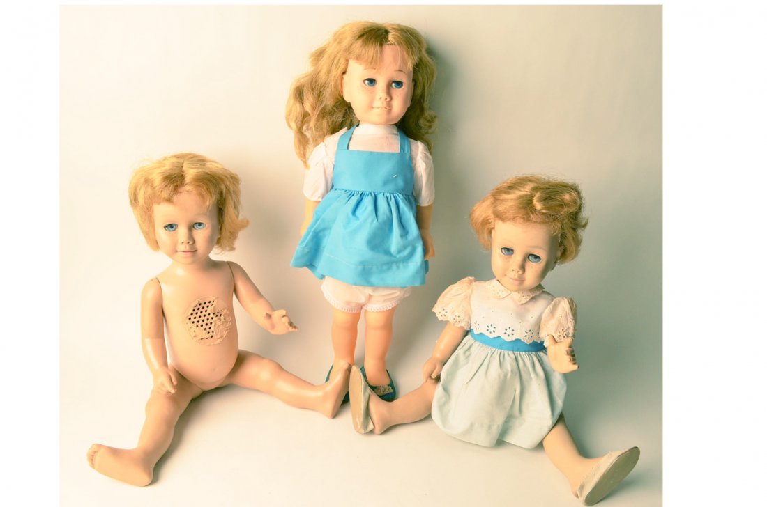 Lot of 3 Vintage Chatty Cathy Dolls: Lot of 3 Vintage Chatty Cathy Dolls. Two are dressed in original Chatty Cathy clothing. One is marked Chatty Baby 1961 By MATTEL, INC. The other 2 are not marked. Pull cords do not work.