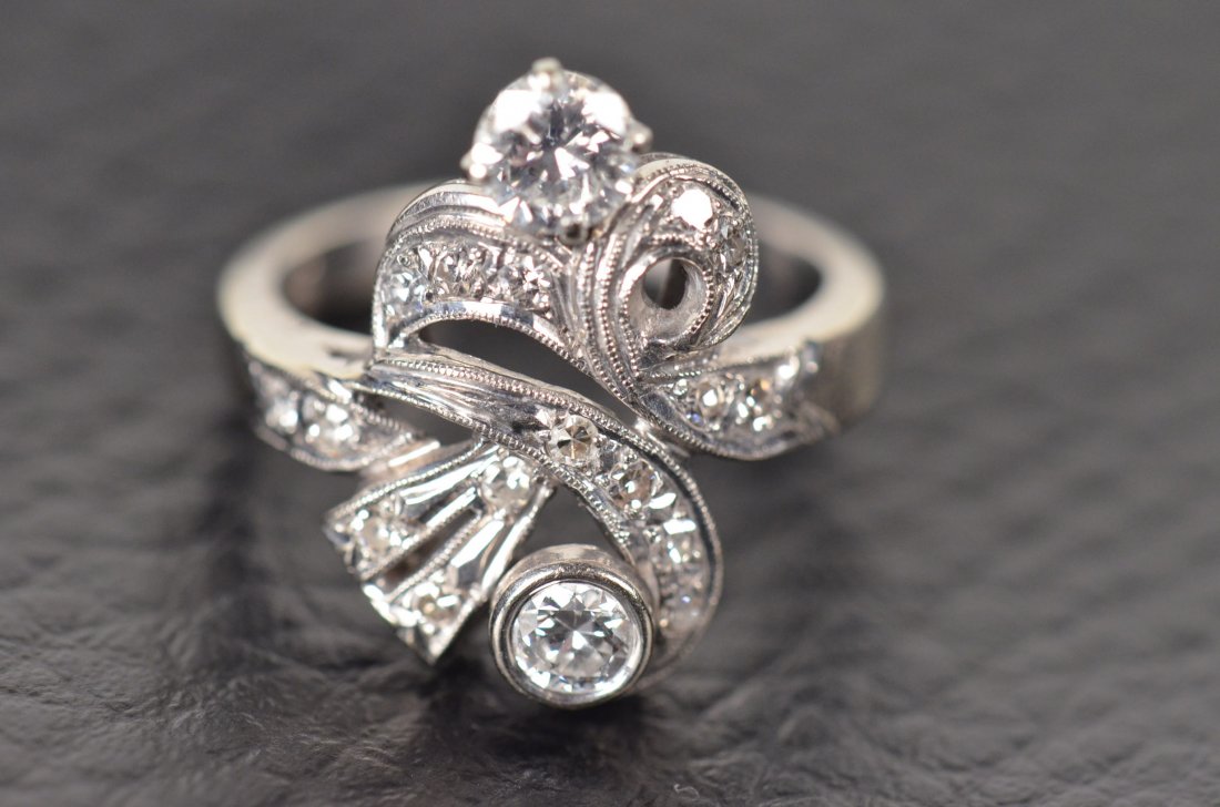 Diamond & White Gold Ring: Unique 14k white gold ring with two medium diamonds and several smaller diamonds. This ring was appraised in 1997 by a prominent jeweler in the Fort Wayne area.