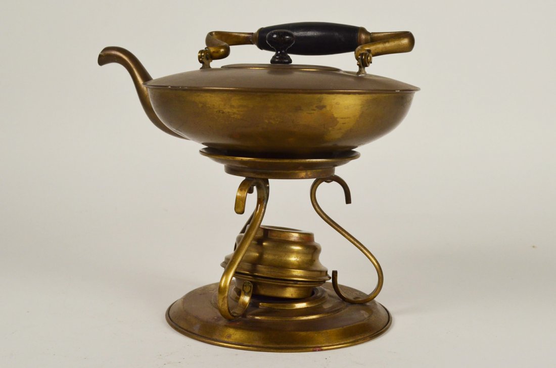 Chinese brass teapot: Chinese brass teapot. JS&SCo Trade Mark on bottom. 10 inches tall with handle. Lots of tarnish. Fair condition.
