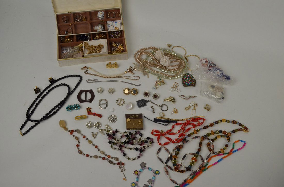 Large lot costume jewelry: necklaces, earings, buckles, stickpins, many ladies rings, several sets of earings including clipon and screw back, one nice onyx napier necklace set, ladies Watham watch.