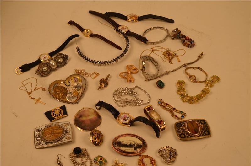 Large Lot of Costume Jewelry: Large Lot of Costume Jewelry A very big lot of jewelry. Belt buckles, tiara, bracelets, pins, brooches, necklaces, watches, Marine Corps pin, cameo locket, parts and pieces. Some of the jewelry is in 