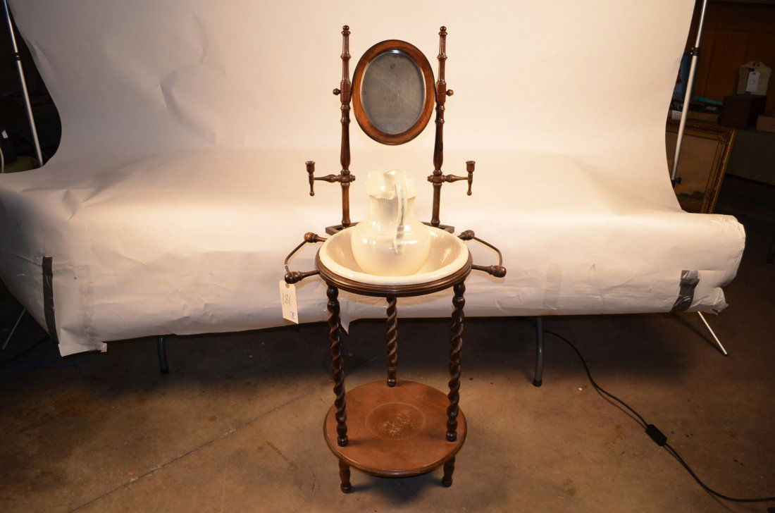 Wash Stand w/ Basin: Wash Stand w/ Basin This piece is a reproduction. The wash stand has both candle holders and towel bars, a tilt oval mirror. Measures 52" tall. Spindle legs.