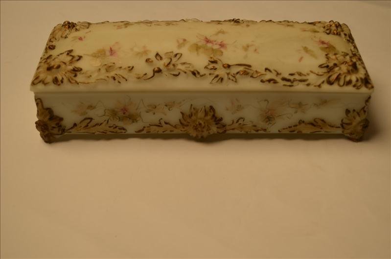 Early Ladies Vanity Dresser Box: Early Ladies Vanity Dresser Box Glass is heavily embossed. Includes bone curler and button hook. Box measures 10.25" by 4".