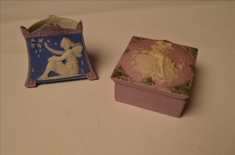 (2) Bisque Pieces/Vase & Covered Box: (2) Bisque Pieces/Vase & Covered Box A wonderful little rounded vase with a fairy depiction and a covered trinket box with a woman and cupid motif. The lid does have a crack. Both pieces are included 