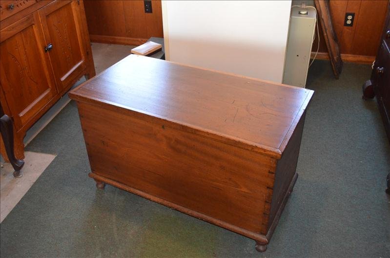 Early Primitive Blanket Chest: Early Primitive Blanket Chest Has brass insert in the key hole. Exquisite dovetail construction. Mixed woods with walnut. Blanket chest has the glove box inside. 38" wide, 19.25" deep, and 23" tall. G
