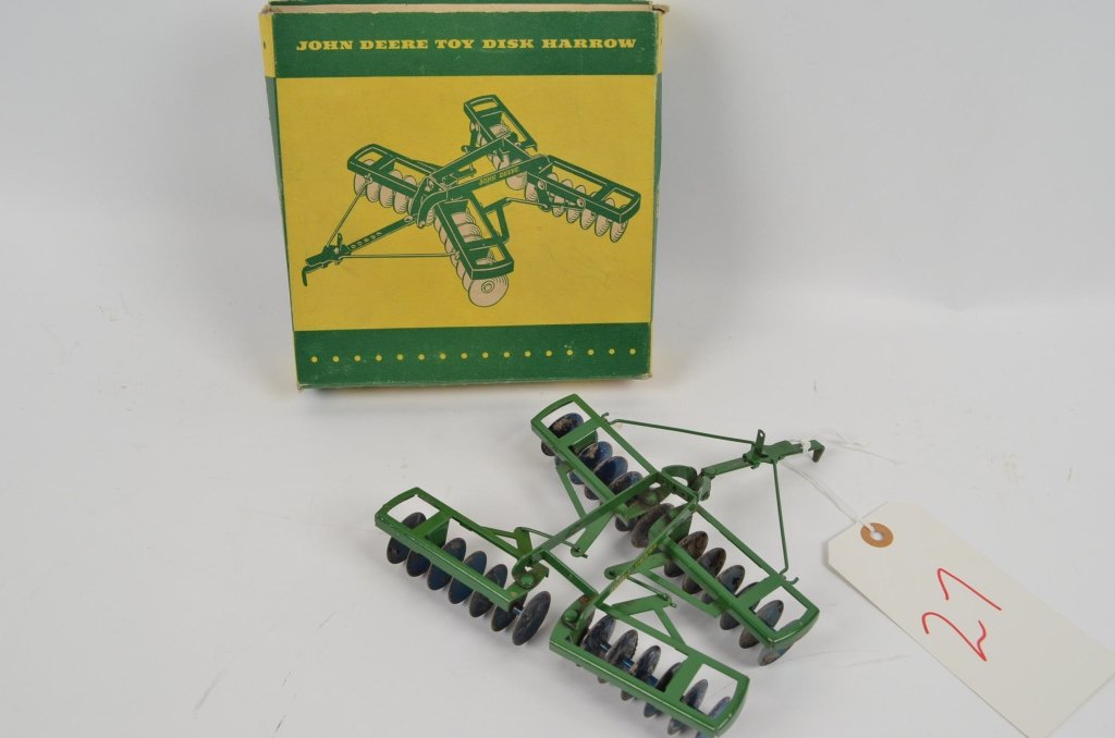 John Deere Toy Disc Harrow: Offered is a model toy pull behind disc harrow. Vintage toy comes with the original box and is in very good condition.