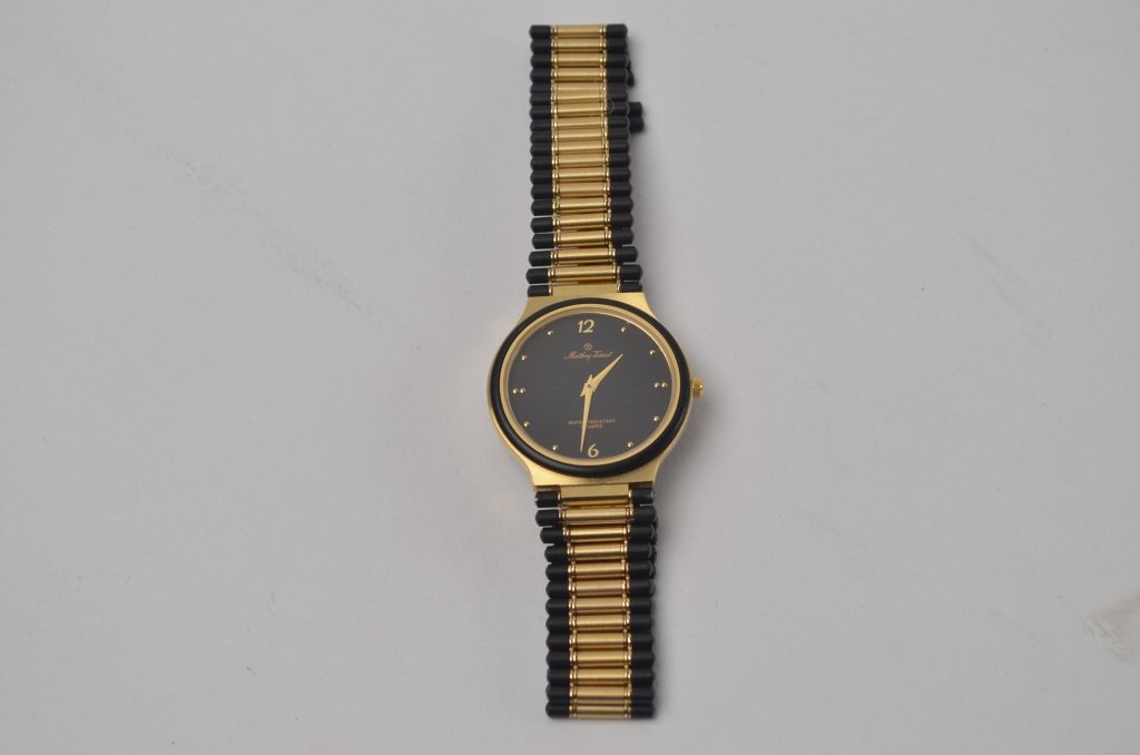 Mathey Tissot Wrist Watch: Metal band. Stainless steel casing back.