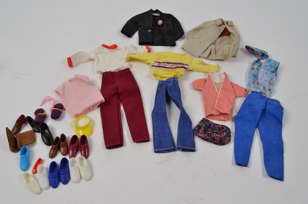 Lot of Original Vintage Ken Doll Clothing: Included are pants, shirts, large assortment of shoes, shorts, sun hat, sunglasses, swimsuit top, and jackets. Most clothing articles are marked with original Ken tag.