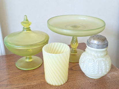 Uranium Glass, Candy Dish, Antique Sugar Shaker: Uranium glass compote stands 7in H. Covered candy dish, 5in diameter x 6in H. Uranium leaf umbrella, cased lemon sugar shaker, 4 1/2in H. Swirled tumbler, 2 1/2in diameter x 3 1/2in H. Please see phot