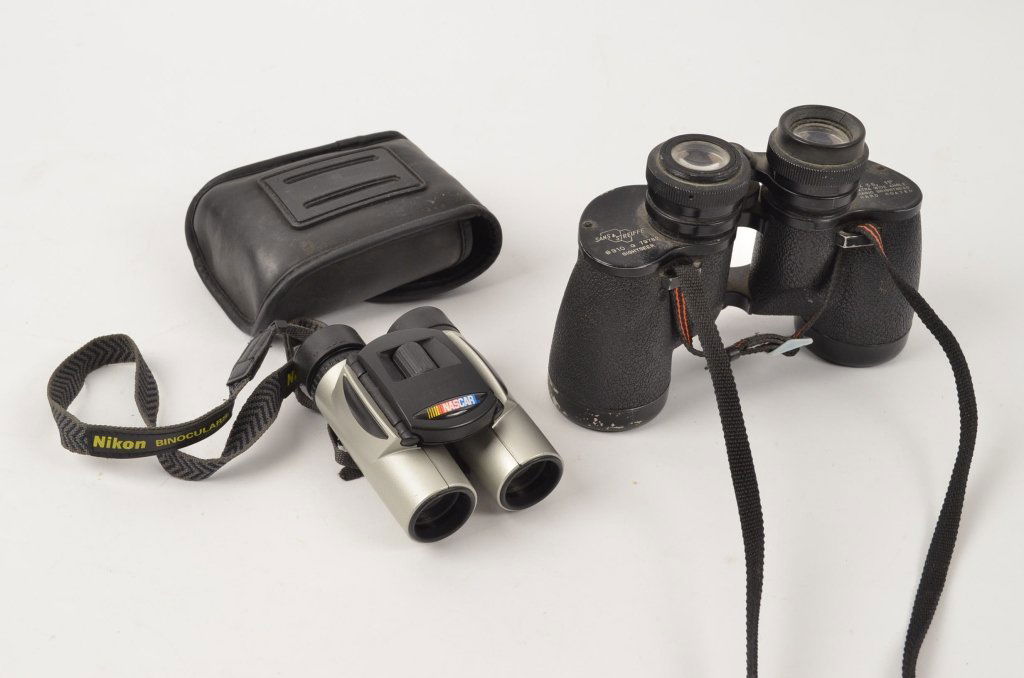 Two Pairs of Binoculars: Sans & Streiffe 7x35 binoculars. The smaller pair are Nikon. The Nikon binoculars have no identifying magnification markings. Nikon has the case included.