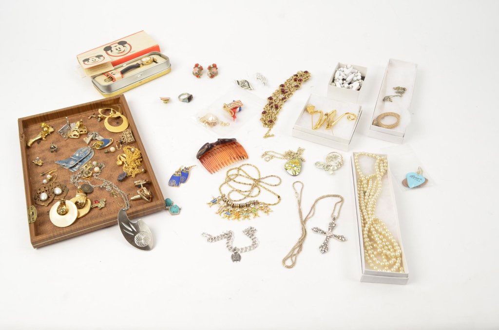Lot of Assorted Costume Jewelry: A large extensive lot of costume jewelry. Rings, necklaces earrings, hair comb, sterling earrings, a sterling charm, equestrian related items, horses, mothers necklace, Mickey Mouse watch, and much mo