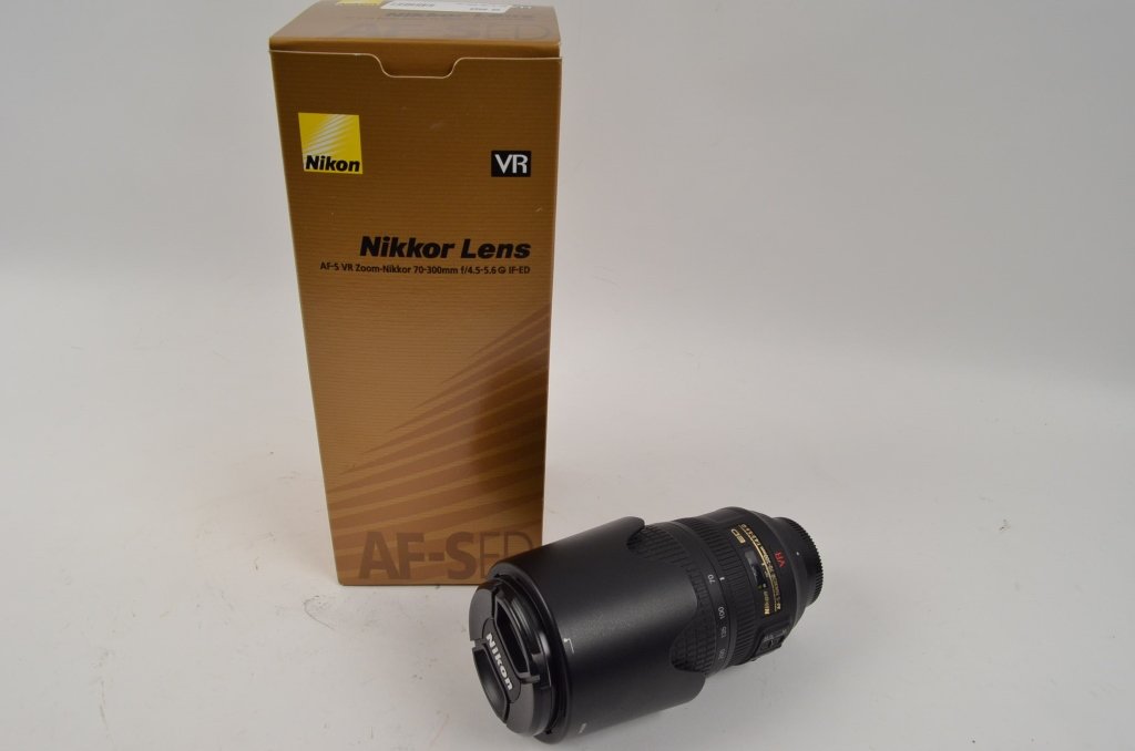 Nikon Professional Grade Camera Lens: Contact Pak Mail (260) 637-4809 for shipping quote prior to bidding. Still with original box. "Nikkor" lens. The lens is a AF-s VR Zoom-Nikkor 70-300mm f/4.5-5.6 G IF-ED.