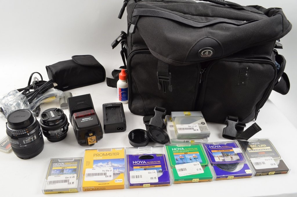 Professional Grade Photography Camera Lenses: Contact Pak Mail (260) 637-4809 for shipping quote prior to bidding. This lot consists of a large Tamrac Ultra Pro 11 camera bag, a Nikon AF Nikkor 28mm lens, a Nikon AF Micro Nikkor 60mm lens, a Niko