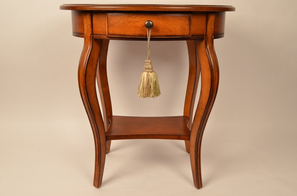 Hand Crafted Oval Walnut End Table: Manufactured by the Butler Specialty Co. Table measures 26" tall. Table top is 24" by 18". An excellent decorative end table with beautiful inlaid design on the table top surface.