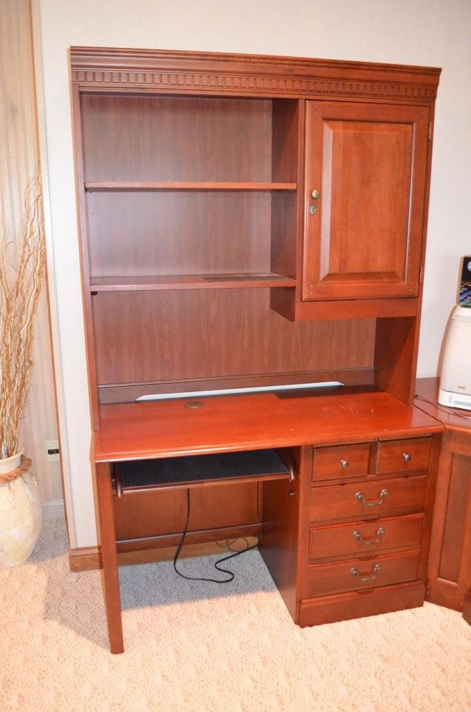 5 Piece Oak Home Office Desk: Quality office desk is oak with a cherry finish. One door at top, three doors at bottom and has two filing cabinet doors. Dove tailed drawers. Printer not included.