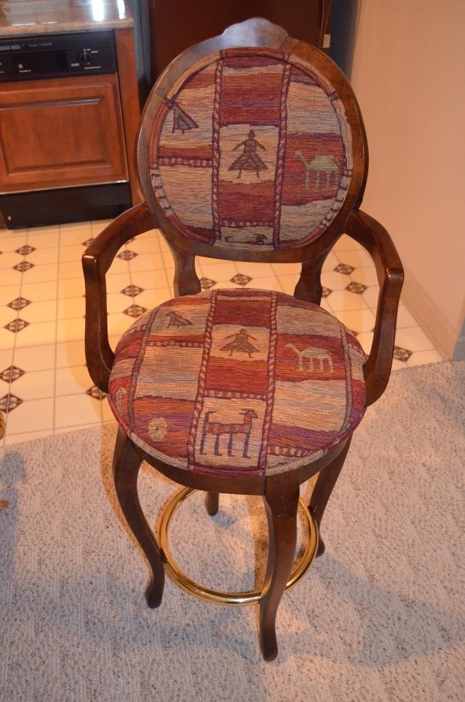 (5) Upholstered Bar Stools: Upholstered in heavy fabric with high seat backs, arm rests, and brass foot rail. Measures 47" H. Five matching bar stools comprise this lot.