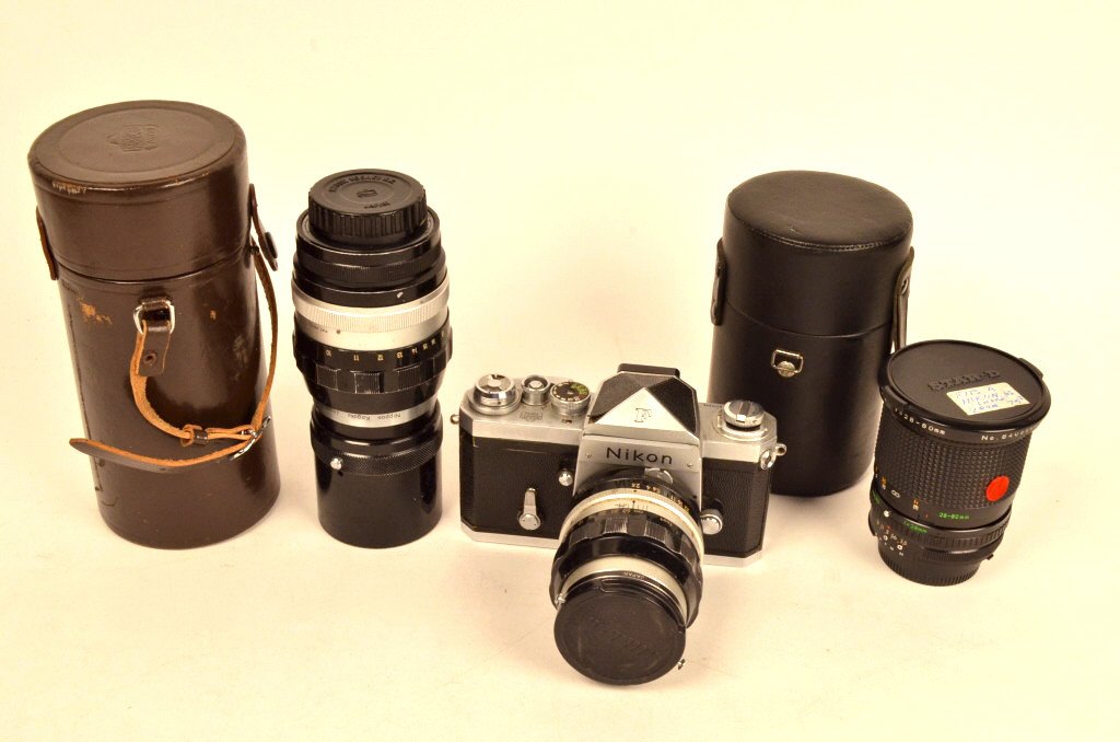 Nikon F Camera w/ Extra Lenses: $25 Shipping/handling/insurance (up to 100) shipped in the continental United States. We do not combine shipping as the packages are sealed and labeled immediately after the item is sold. Internationa