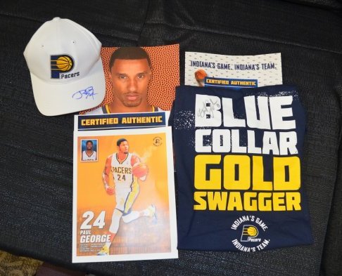 PACERS- PAUL GEORGE AND ORLANDO JOHNSON PACKAGE - $150: Autographed hat from Paul George and shirt from Orlando Johnson with photography. Certified and donated by the Pacers.