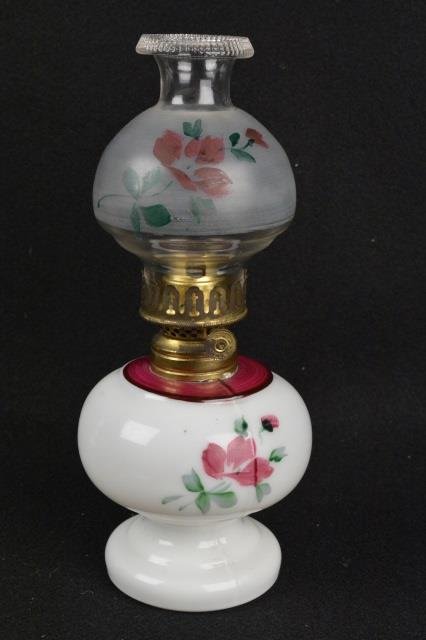 *Milk & Clear Glass Miniature Oil Lamp: Milk glass base and clear shade, hand painted w/ floral sprays, Hornet burner, 8.75" H. Contact our recommended 3rd party "for profit" shipper Pak Mail at (260) 637-4809 or Pakmail419@yahoo.com for sh