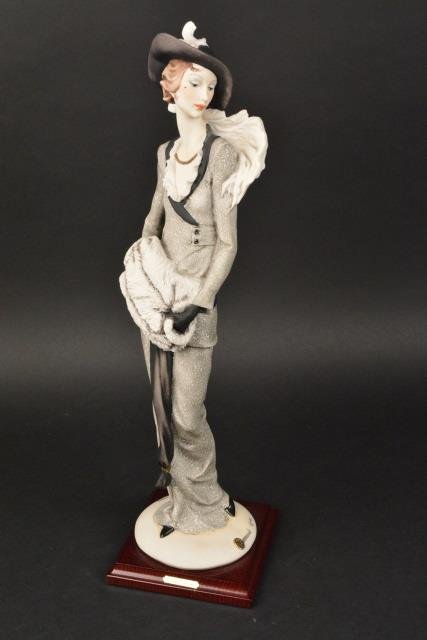 *Florence Giuseppe Armani Figurine Lady with Muff: Florence, Original Giuseppe Armani Figurine Model No. 388/C, Lady with Muff. Mounted on a wood base, includes COA, original packaging and box. Limited Edition 2765/5000. Year 1997, 19.25" H. Contact o