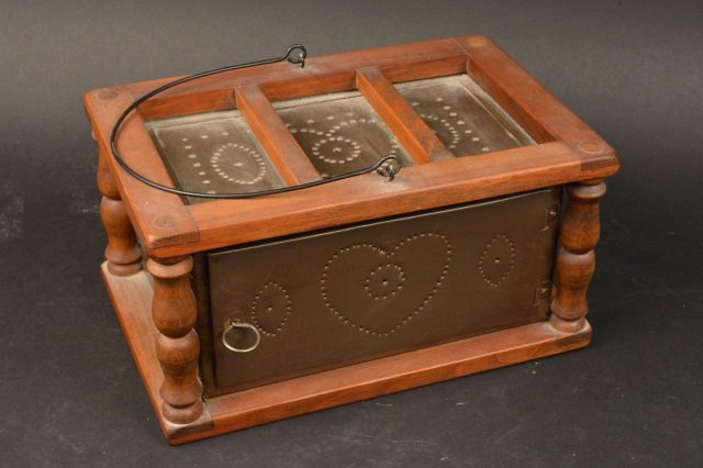 Tin Punched Foot Warmer: Primitive Tin Punched Foot Warmer. May also be used as a cricket or insect box. Heart design and latch to open side. Measures 11" x 7" x 5.5". Contact our recommended 3rd party "for profit" shipper Pa